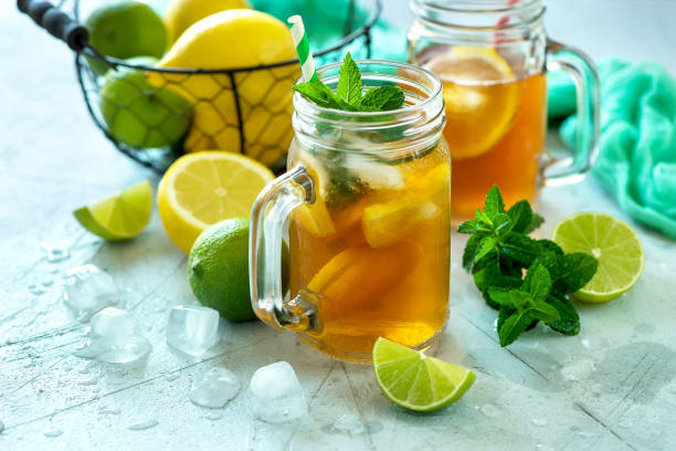 istock Iced tea, summer cold drink  with lemon and mint, limes and ice cubes, refreshment 844477938