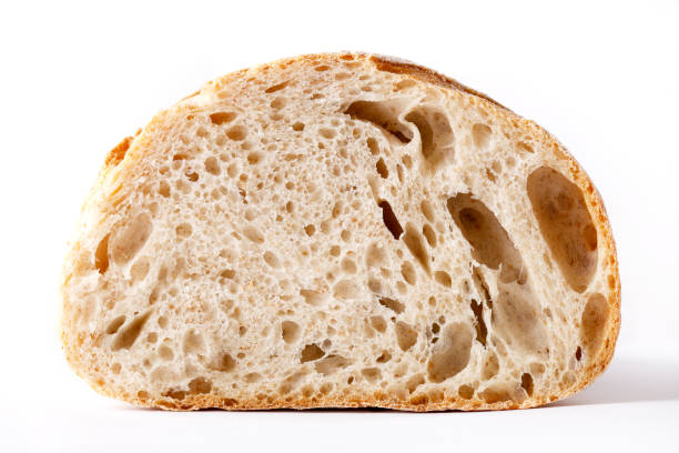 istock Bread loaf sliced in half. Wholegrain wheat bread on white background 844478044