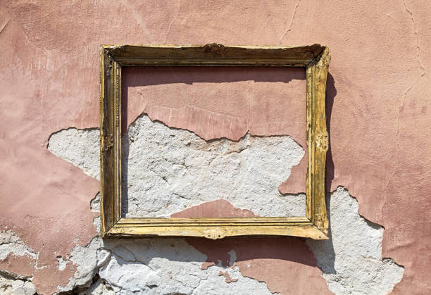 istock Empty old wooden picture frame on ruined wall 844481958