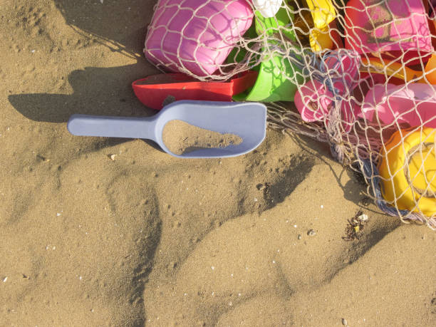 istock coloured beach toys over the sand 844484360