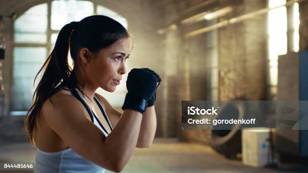 Beautiful Athletic Woman Holds Her Arms Ready For Defending Herself It Is A Part Of Her Intensive Cross Fitness Gym Training Stock Photo - Download Image Now