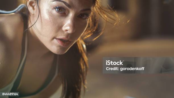 Closeup Shot Of A Beautiful Athletic Woman Looks Into Camera Shes Tired After Intensive Cross Fitness Exercise Stock Photo - Download Image Now