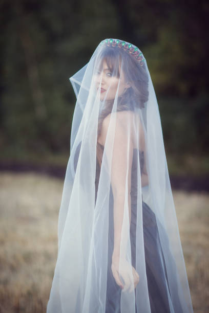 istock woman with a veil in the field 844492676