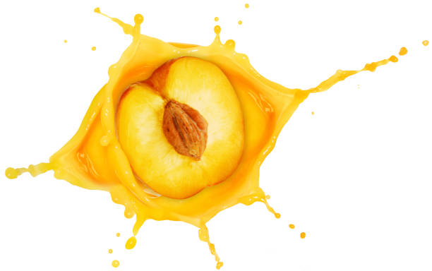 peach in juice splash isolated