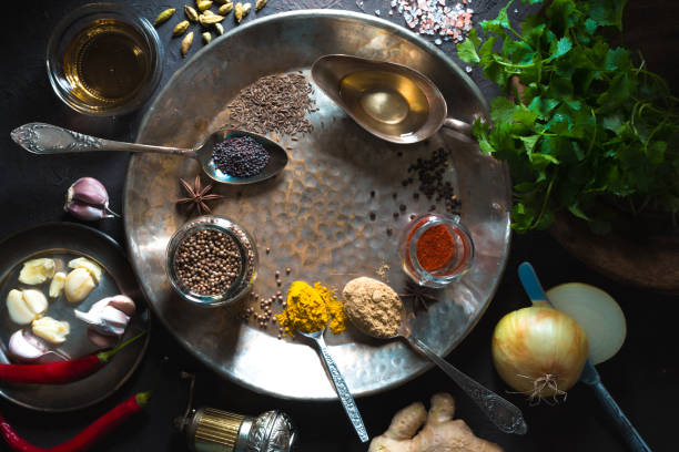 istock Different spices on metal plate on  dark background top view 844497278