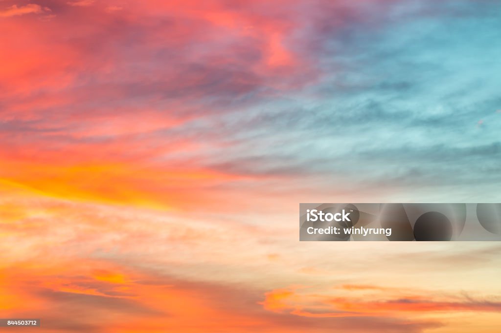 Colorful sky background in twilight. Colorful sky background in twilight, with golden, blue and orange, in soft blurred style, amazing beautiful sunset. Sunset Stock Photo