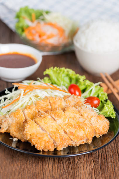 istock Crispy fried pork cutlet with sauce. 844504024