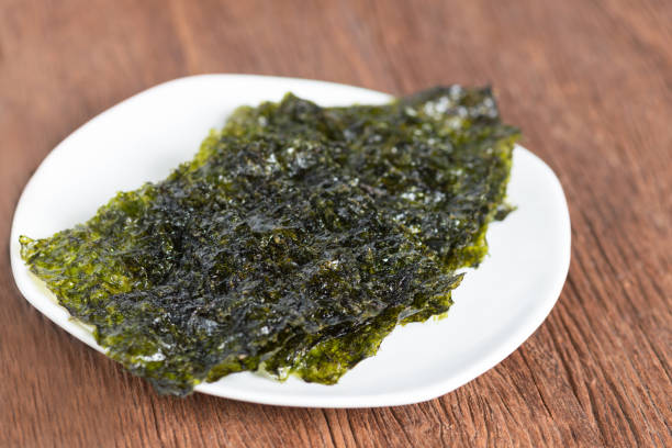 istock Nori sheet dried seaweed, Crispy seaweed on plate. 844504124