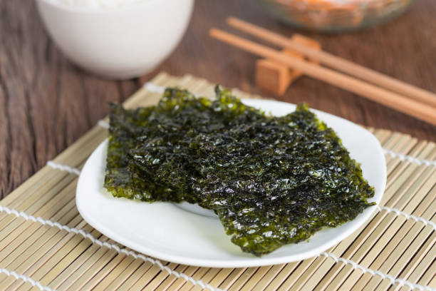 istock Nori sheet dried seaweed, Crispy seaweed on plate. 844504152