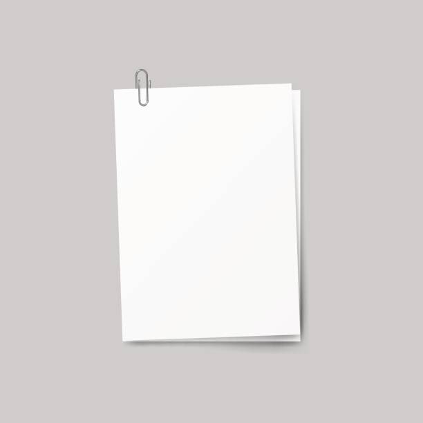 istock Realistic several sheets of paper and a metal paper clip isolated on background. 844508474