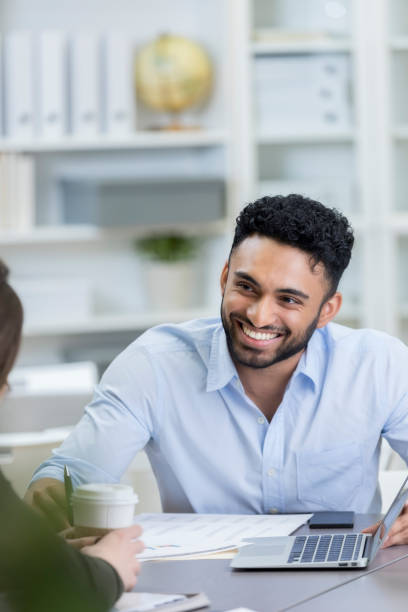 istock Young male executive interviews potential employee 844508580