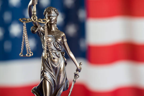 istock Law and justice symbols on USA flag background. 844515366