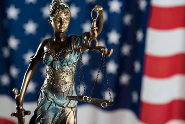 istock Law and justice symbols on USA flag background. 844515744