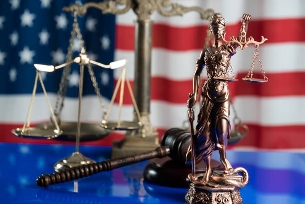 istock Law and justice symbols on USA flag background. 844515876