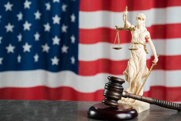 istock Law and justice symbols on USA flag background. 844516006
