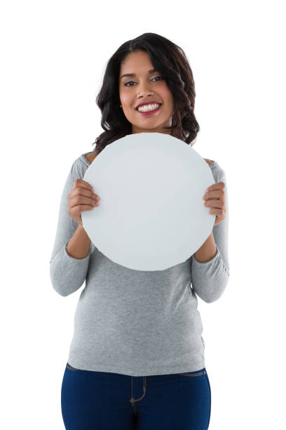istock Smiling woman holding circle shaped placard 844519684