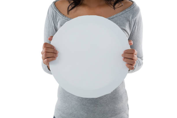 istock Mid section of woman holding circle shaped placard 844522616