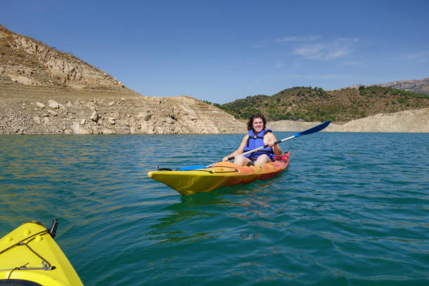 istock Young woman rowing in a kayak 844535206