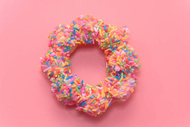 istock colorful doughnut on pink background 844536390