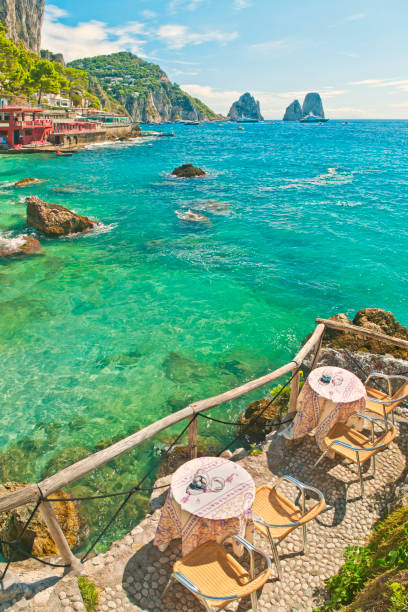 istock two tables at beach cafe with sea and mountain view 844546212