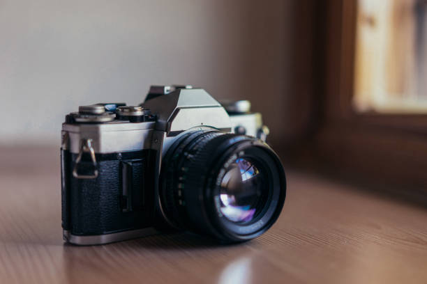istock Vintage film camera at the table 844547202