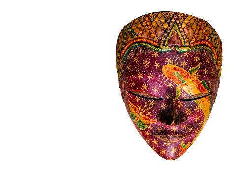 Batik Wooden mask souvenir from Indonesia isolated on white background