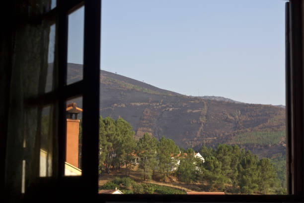 istock Open wooden window with a view to the mountain 844558914