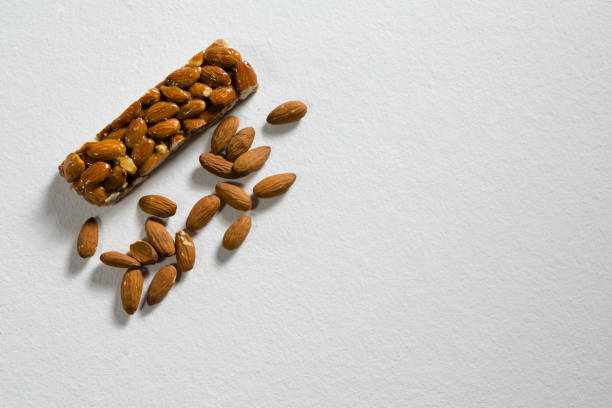 istock Granola bar and almond on white background 844567018