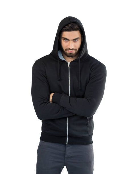 Handsome man posing with arms crossed against white background