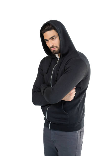 istock Man posing with arms crossed against white background 844570218