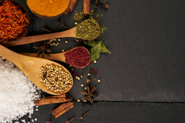 istock Various herbs and wooden spoon with spices 844580334