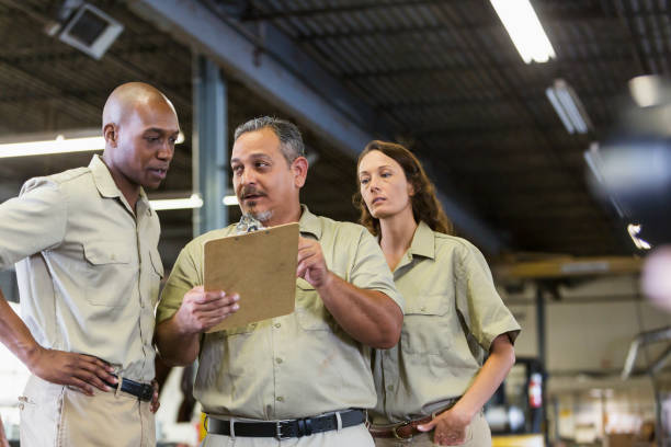 istock Workers in truck repair shop 844593498