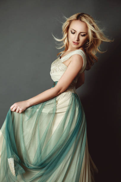 istock blonde female dancing in gorgeous dress 844595986