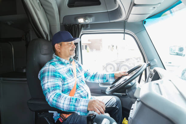 istock Hispanic man driving a semi-truck 844597266