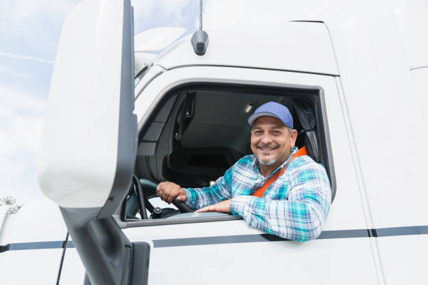 istock Hispanic man driving a semi-truck 844597516