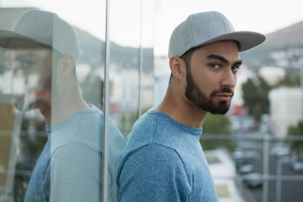 istock Handsome man leaning on glass 844614860