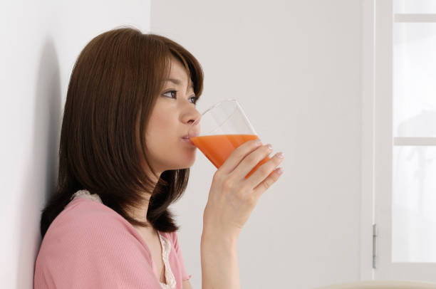 istock Woman drinking vegetable juice 844615354