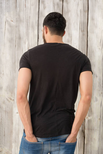 istock Rear view of man standing with hands in pocket 844615618