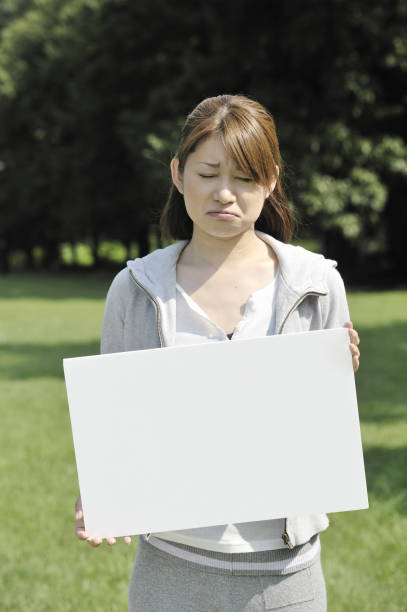 istock Woman with a white board 844616840