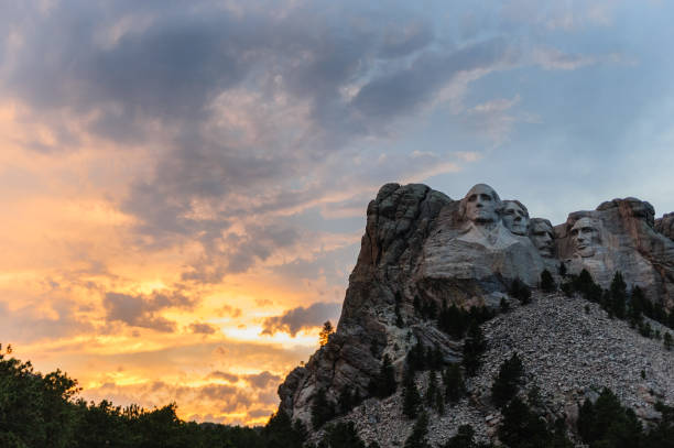 Mount Rushmore in the evening light Bright Sunset colors behind Mount Rushmore National Monument keystone south dakota photos stock pictures, royalty-free photos & images