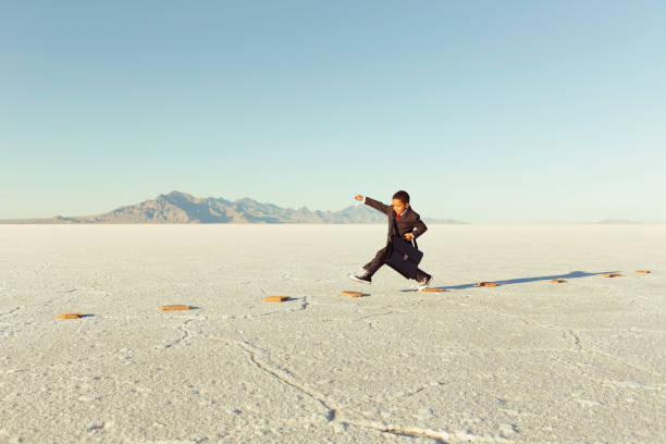 istock Young Business Boy On Stepping Stones 844638630