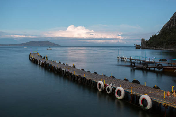 istock mooring in the bay, floating pier, a long pier 844648666