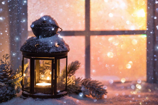 winter decoration with a candlestick near the snow-covered window - window snow christmas decoration imagens e fotografias de stock