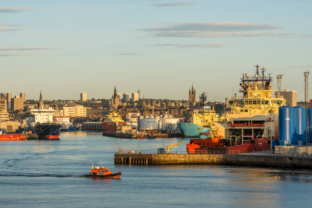 Aberdeen, Scotland, UK, August 30th 2017. Aberdeen harbour basin, ships, piers, city centre and small lifeboat.