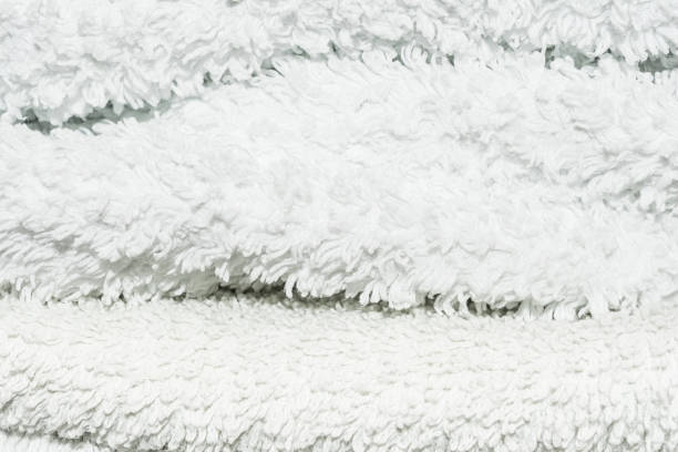 istock texture of white terry cloth, unevenly stacked towels 844693172
