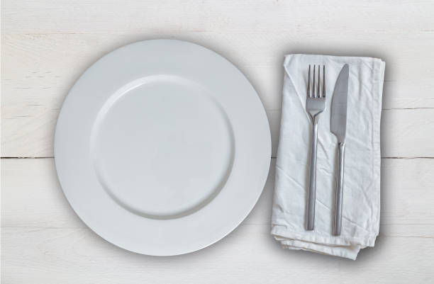 istock Empty plate with cutlery on white vintage wood 844694560
