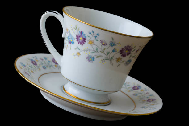 istock China Tea cup and Saucer isolated on black back ground dutch tilt 844702932