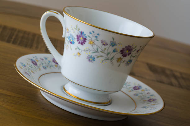 istock China Tea cup and Saucer isolated on black back ground dutch angle tilt 844703030
