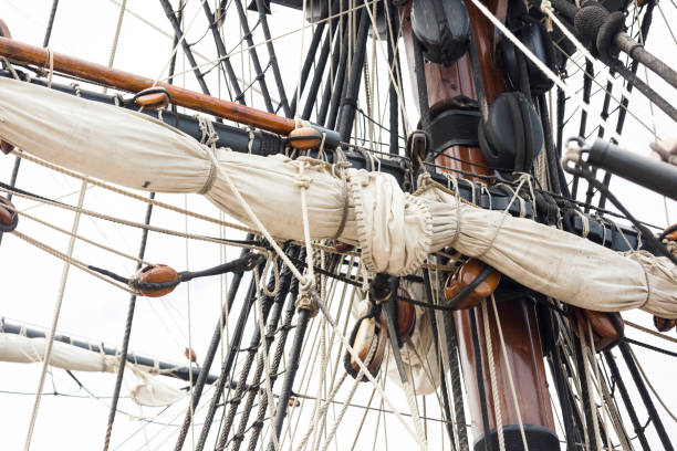 Folded sail and mast on an old sailboat, full frame horizontal composition with copy space