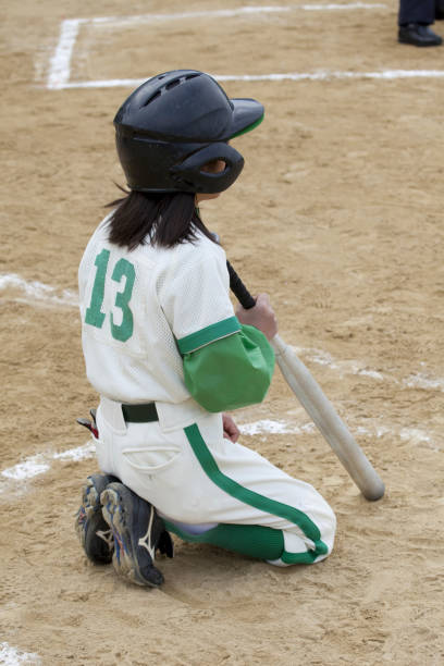 istock Batting baseball girls 844726270